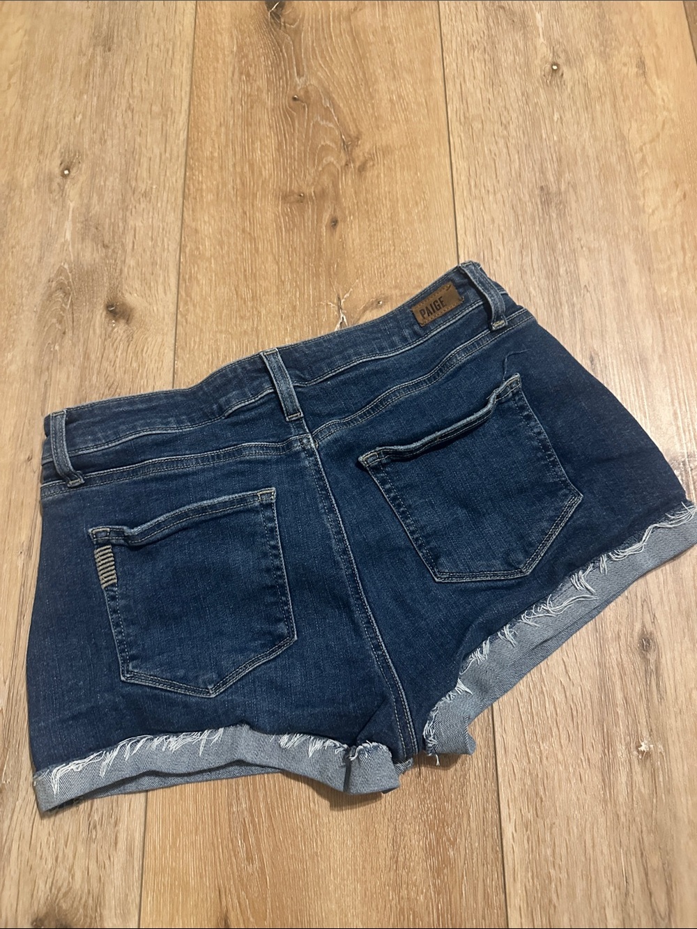 PAIGE Indigo Frayed Hem Denim Shorts